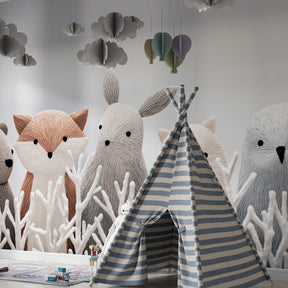 Cute woodland animals wallpaper creating cozy toddler bedroom decor with natural tones