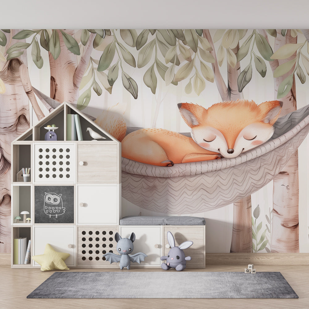 Woodland nursery featuring baby fox wallpaper with birch trees and knitted hammock decor