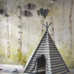 Peaceful baby nursery with watercolor forest mural wallpaper creating natural woodland atmosphere