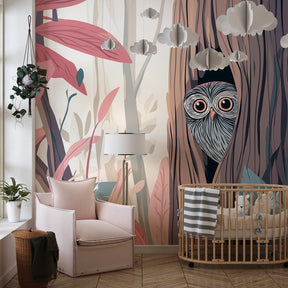 Nature-themed owl wallpaper in bright kids playroom with colorful toys and reading corner