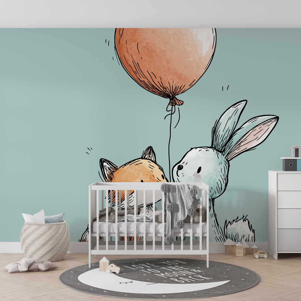 Soft pastel fox and bunny mural wallpaper complementing modern nursery furniture and decor