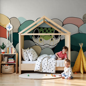 Playful frog mural wallpaper decorating modern nursery with natural wood furniture by Kids-Mundo