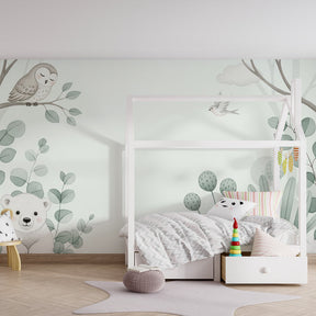 Peaceful animal mural wallpaper featuring owl and bird in calming green tones for toddler room