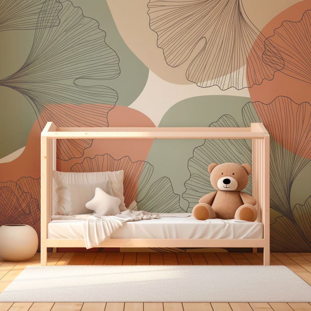 Modern ginkgo botanical mural wallpaper in children's bedroom with soft green and orange tones by Kids-Mundo