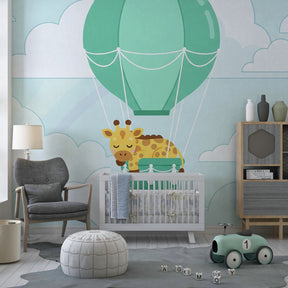Children's bedroom featuring giraffe balloon wallpaper creating magical sky adventure atmosphere