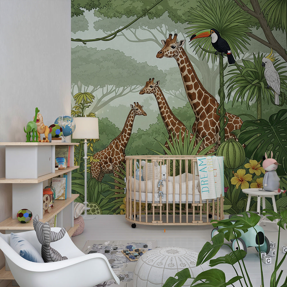 Kids-Mundo giraffe family mural covering a playroom wall with soft toys nearby