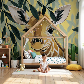 Gentle giraffe mural wallpaper in bright baby nursery with natural wood crib by Kids-Mundo