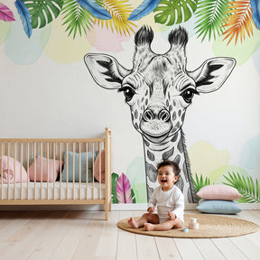 Giraffe mural wallpaper creating tropical safari nursery decor with natural wood furniture by Kids-Mundo