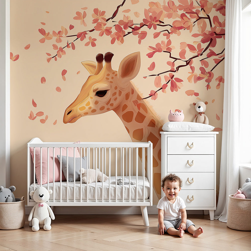 Kids-Mundo giraffe wall mural with pink blossom branches in a soft neutral nursery