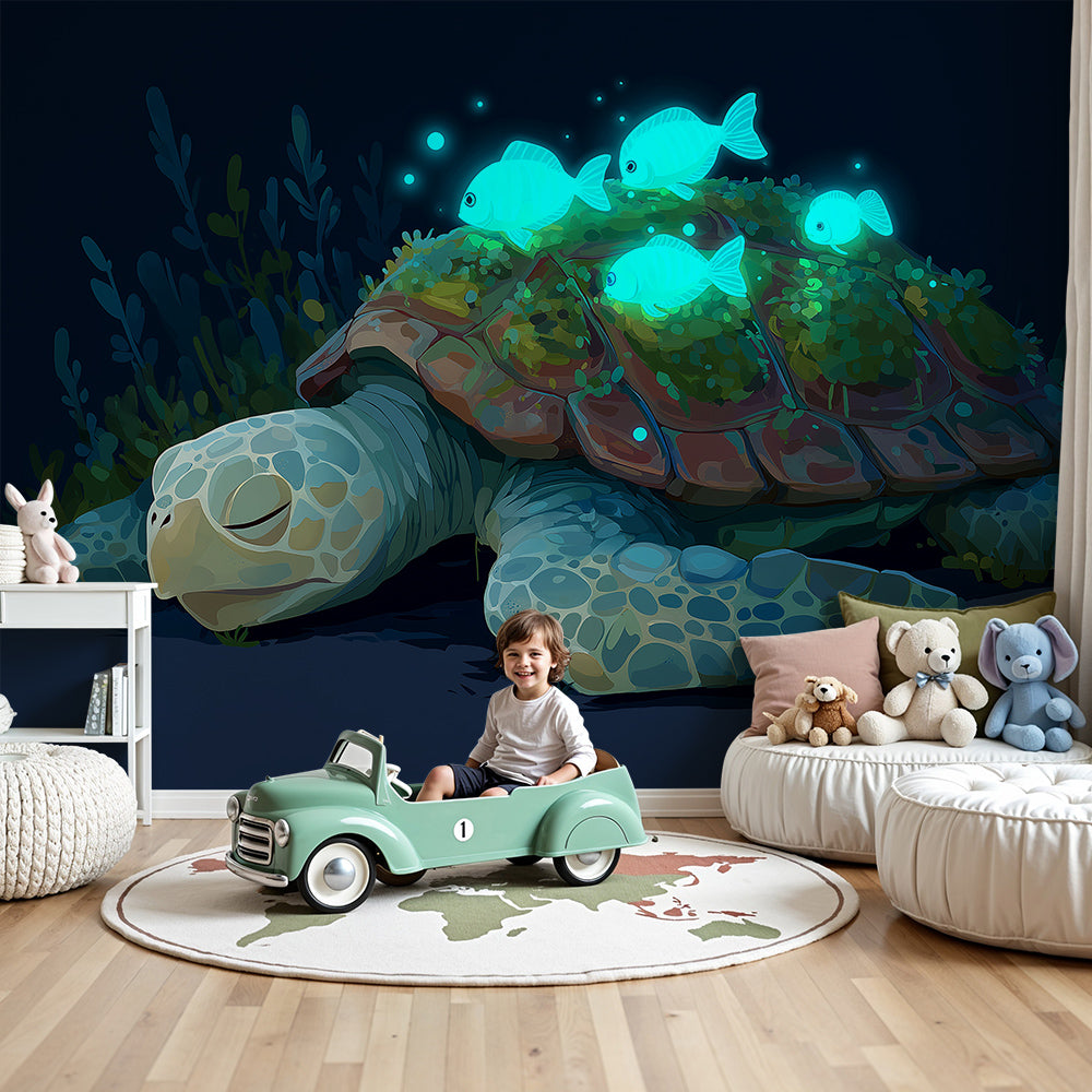 Kids-Mundo turtle wall mural in a dark nursery with a cot beneath glowing reef fish