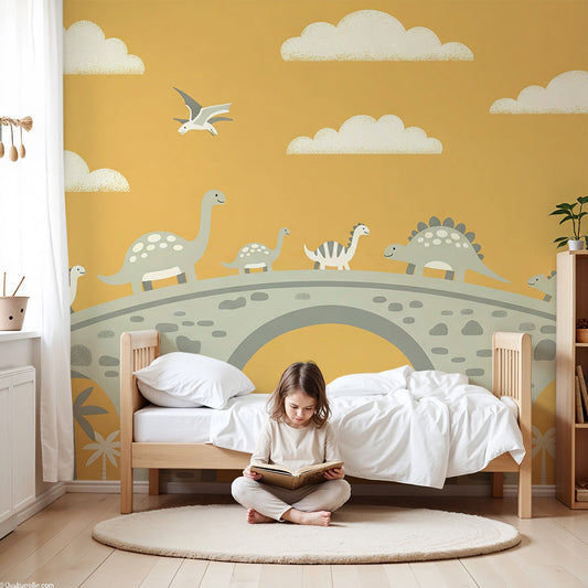 Kids-Mundo golden sky dinosaur bridge wall mural styled in a warm-toned nursery with a cot