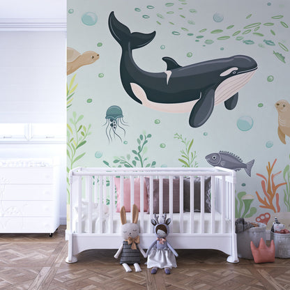 Kids-Mundo whale and turtle wall mural behind a bed in a fresh kids bedroom
