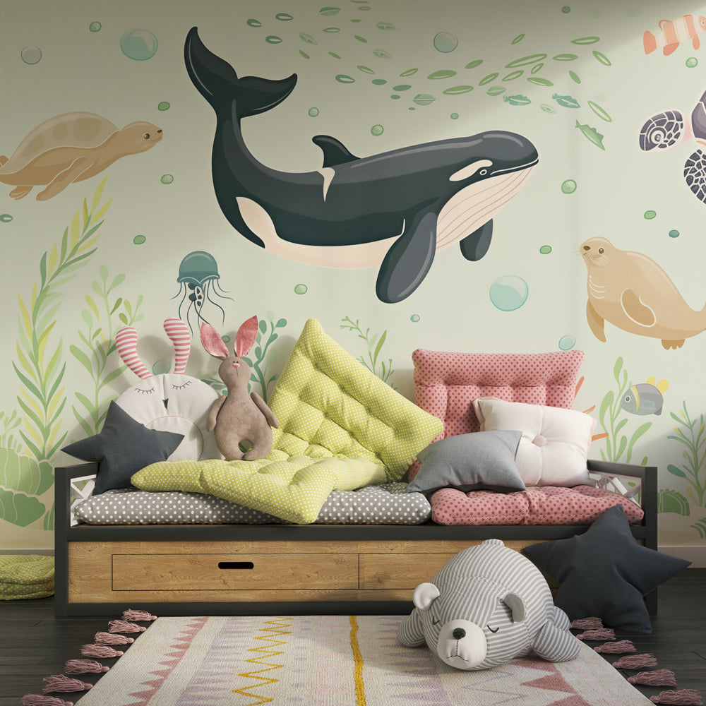 Kids-Mundo green ocean wall mural with a whale and seal covering a playroom wall