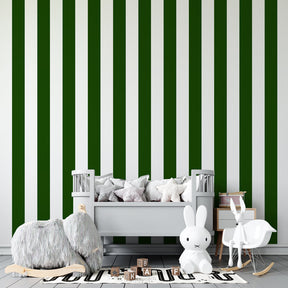 Vertical green and white stripe wallpaper accent wall in bright kids playroom setting