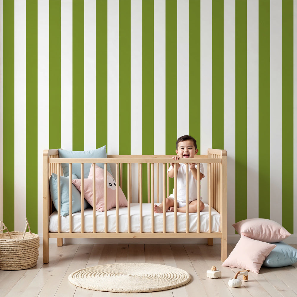 Green striped mural wallpaper in modern white nursery with natural wood furniture by Kids-Mundo