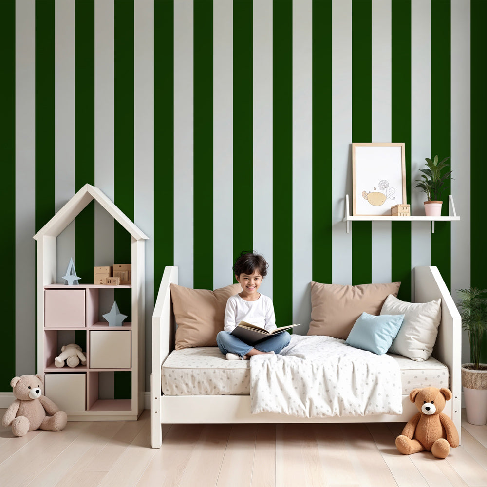 Kids-Mundo green and white stripe wall mural behind a cot in a fresh, modern nursery.