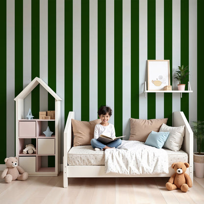 Kids-Mundo green and white stripe wall mural behind a cot in a fresh, modern nursery.