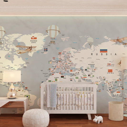 Kids-Mundo neutral world map mural on a kids' bedroom wall, vintage biplanes and balloons in muted grey tones.
