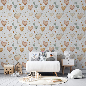 Children's bedroom featuring heart balloon wallpaper in soft pink and beige tones