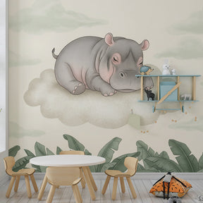Close-up view of sleepy hippo mural wallpaper showing delicate cloud details and botanical elements