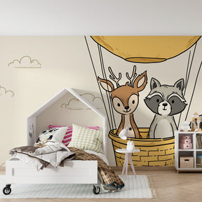 Adventure themed mural wallpaper with deer and raccoon in children's bedroom decor