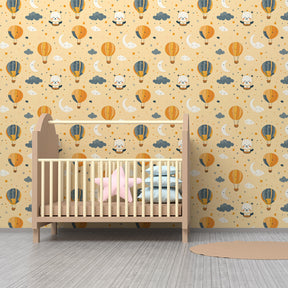 Children's bedroom featuring whimsical hot air balloon wallpaper with floating bears and clouds