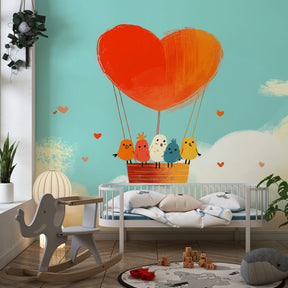 Soft blue pink hot air balloon wallpaper installed in cozy nursery setting by Kids-Mundo