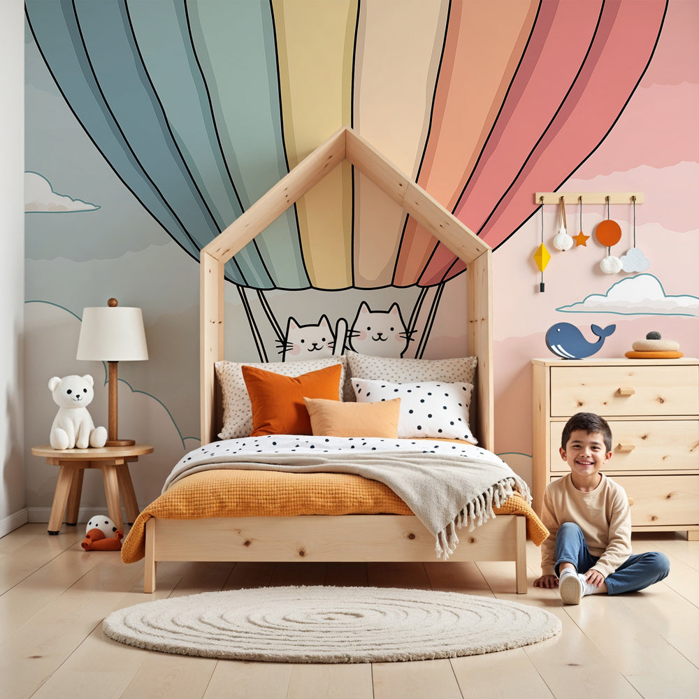 Hot air balloon cats mural wallpaper in modern nursery with light wood furniture by Kids-Mundo