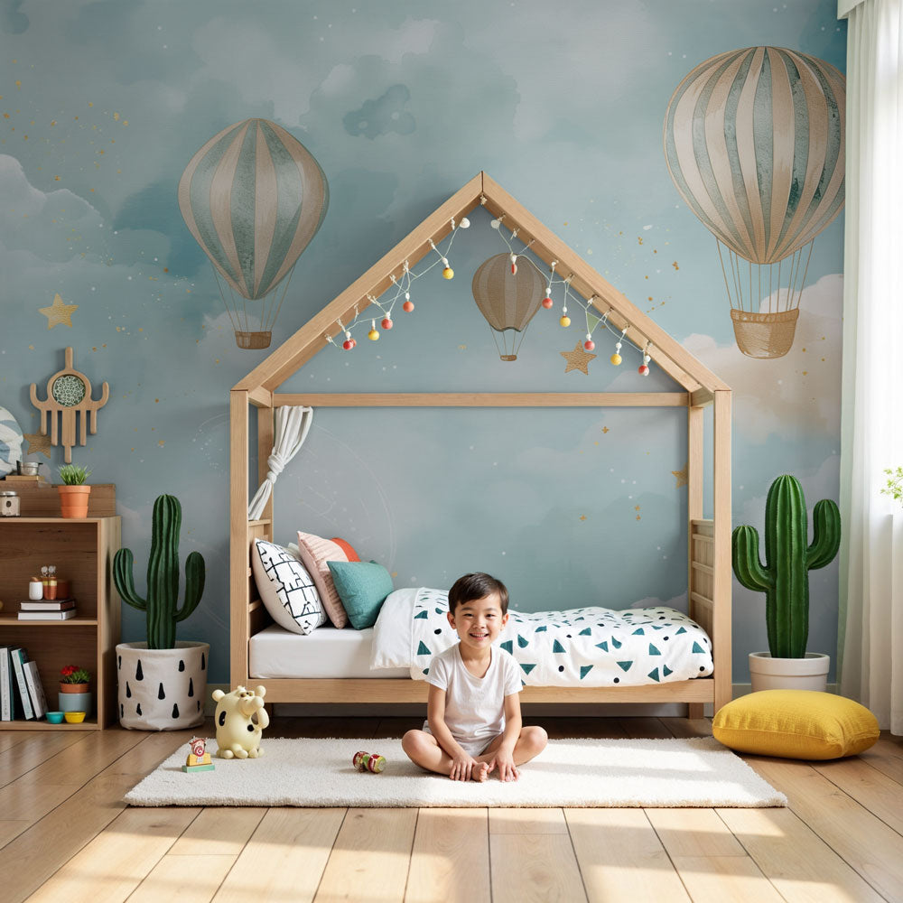 Hot air balloon mural wallpaper in soft blue nursery with white crib by Kids-Mundo