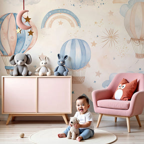 Hot air balloon mural wallpaper in dreamy pastel nursery with crib and soft lighting by Kids-Mundo