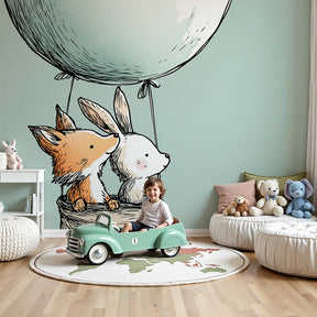 Hot air balloon animal mural wallpaper in modern baby nursery with wooden crib by Kids-Mundo
