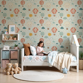 Hot air balloon mural wallpaper creating dreamy nursery decor with smiling balloons and sun by Kids-Mundo