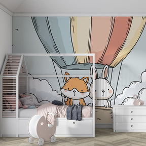 Whimsical hot air balloon wallpaper creating magical playroom atmosphere with animal characters