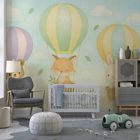 Whimsical hot air balloon mural wallpaper featuring woodland animals in bright playroom setting