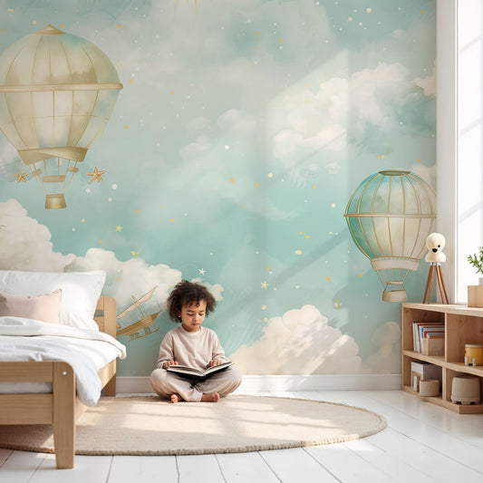 Kids-Mundo hot air balloon wall mural in a soft pastel nursery with clouds and stars, made to measure.