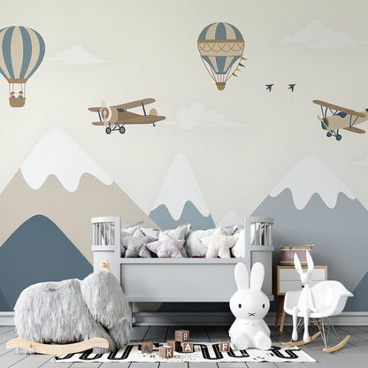 Kids-Mundo hot air balloons and biplanes wall mural styling a travel-themed bedroom.
