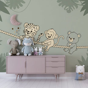 Baby nursery decorated with jungle animals mural wallpaper and natural wood accessories