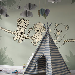 Safari animals wallpaper creating cozy atmosphere in toddler bedroom with wooden furniture