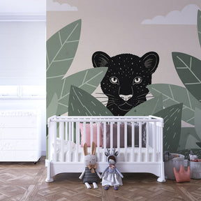 Mysterious leopard wallpaper in children's bedroom with natural wood furniture and safari decor theme