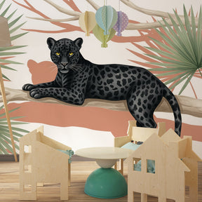 Safari animal wallpaper featuring leopard on tree branch in stylish children's playroom setting