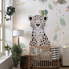 Tropical jungle leopard mural wallpaper with green leaves in children's playroom setting