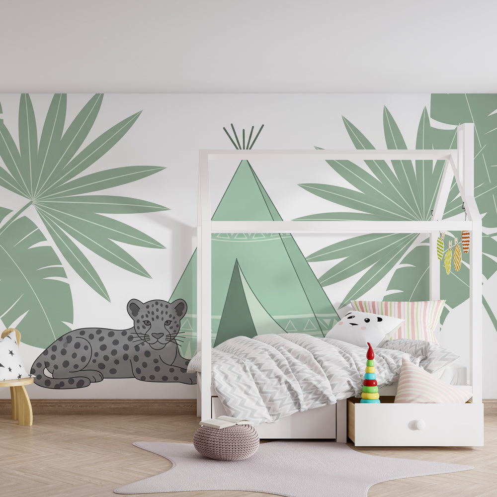 Tropical jungle wallpaper creating adventure-themed playroom atmosphere with tent and wildlife