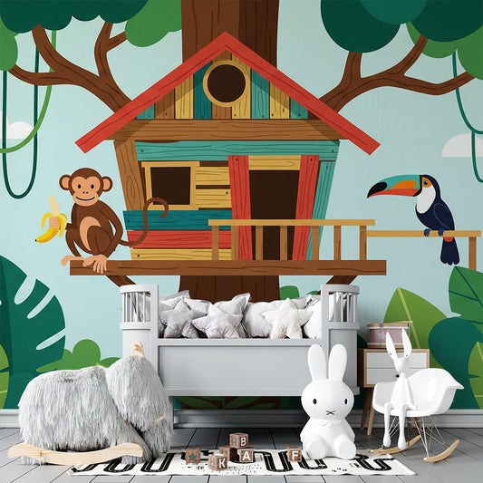 Kids-Mundo colourful treehouse wall mural behind a bed in a jungle-themed kids bedroom.