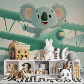 Pastel koala pilot wallpaper with vintage airplane design for kids playroom decor by Kids-Mundo