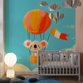 Whimsical koala pilot mural wallpaper with clouds for children's adventure-themed room