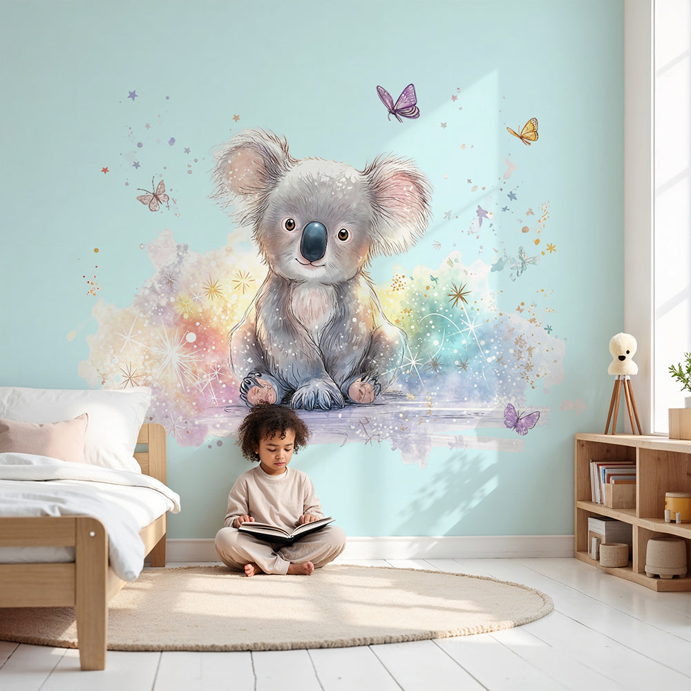 Kids-Mundo sparkly koala wall mural in a soft blue nursery with a cot and star mobile