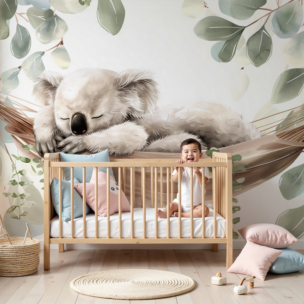 Kids-Mundo sleeping koala wall mural styled as a feature wall in a sage-green nursery