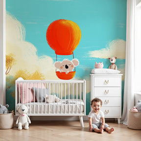 Koala hot air balloon mural wallpaper in modern nursery with wooden crib by Kids-Mundo