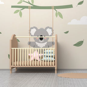 Peaceful koala mural wallpaper creating serene atmosphere in baby bedroom decor
