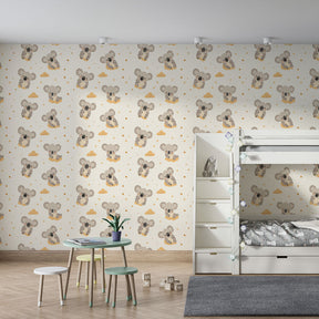 Children's bedroom featuring adorable koala wallpaper with clouds and stars